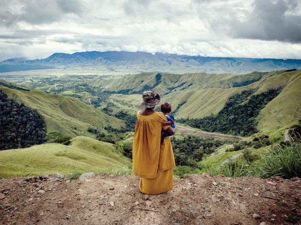 A woman holds a child in remote Kassam Pass, PNG. Activists believe domestic violence is particularly high here. 2012. Source: Vlad Sokhin